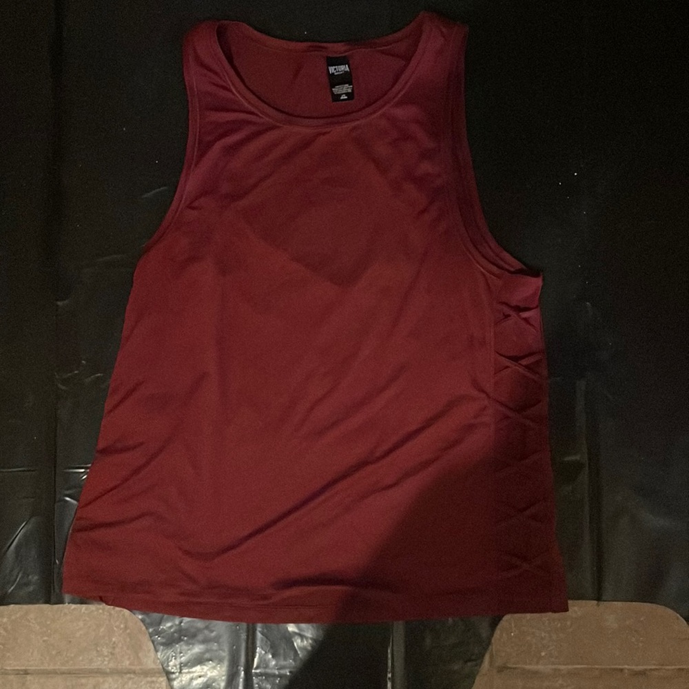 A maroon Victoria’s Secret sport tank top